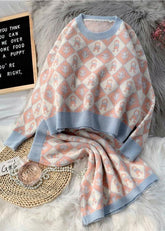 Conjunto de suéter con estampado de dibujos animados de temperamento de nueva moda de otoño e invierno de 2021, suéter de cuello redondo, media falda, conjunto de dos piezas